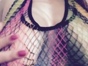 Carlycurvy plays in bright colored fishnets